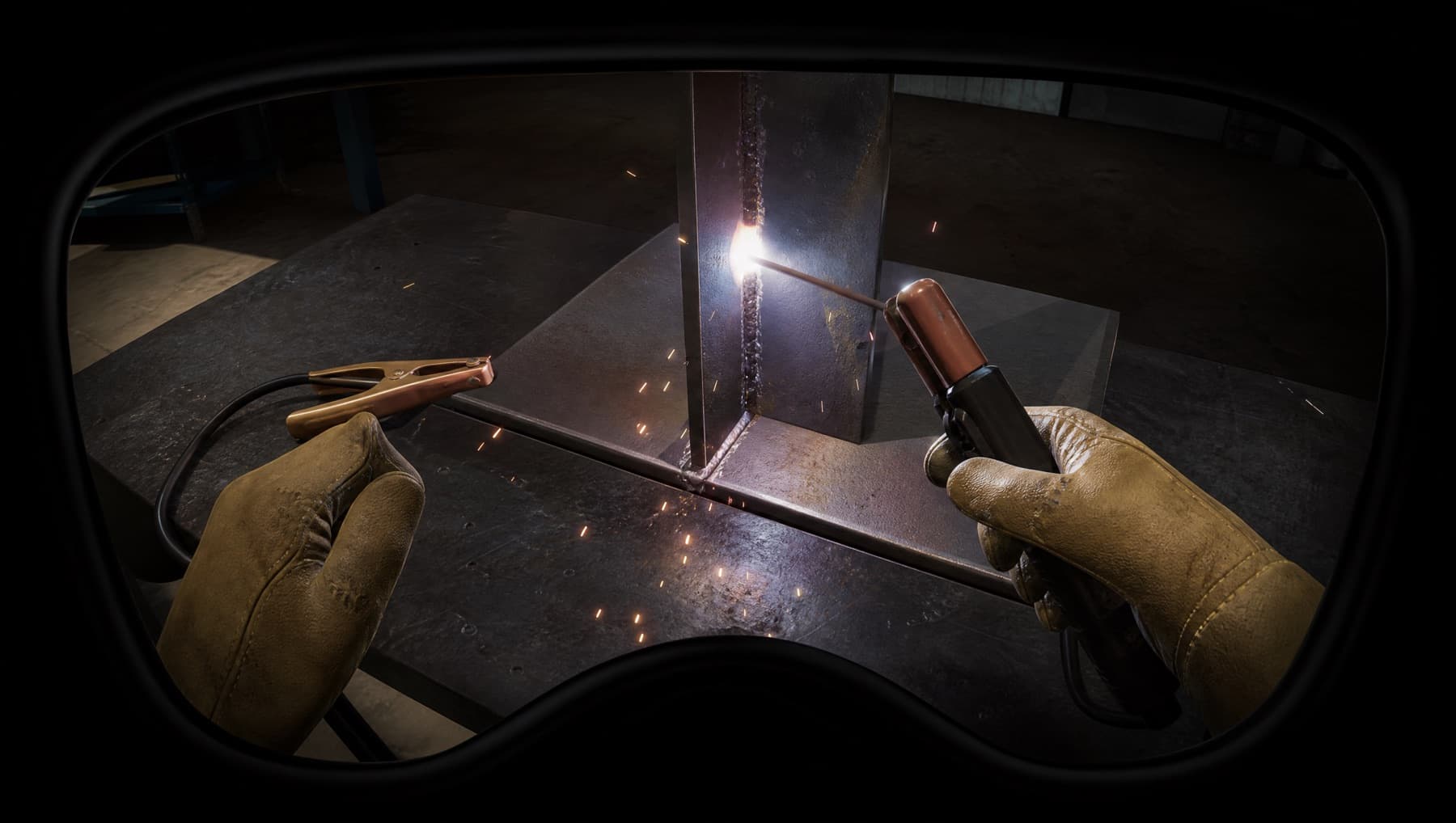 First-person view inside the welding simulation: gloved hands striking an arc on a steel fillet joint